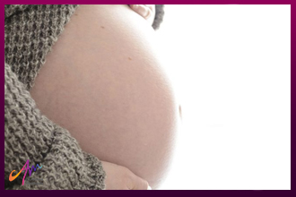 الحمل بعد عملية شد البطن .. هل يؤثر على صحة الأم والجنين؟